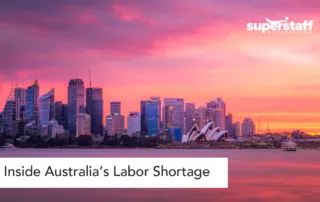 Arial view of Canberra at night. Caption reads "Inside Labor Shortage in Australia."