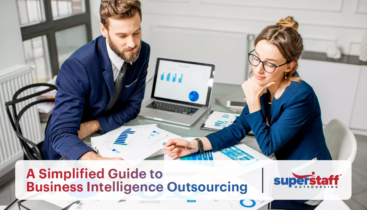 A-Simplified-Guide-to–Business-Intelligence-Outsourcing An image showing two data experts discussing graphs. The title of the blog "Decoding Data Excellence: A Simplified Guide to Business Intelligence Outsourcing" is also on the image.
