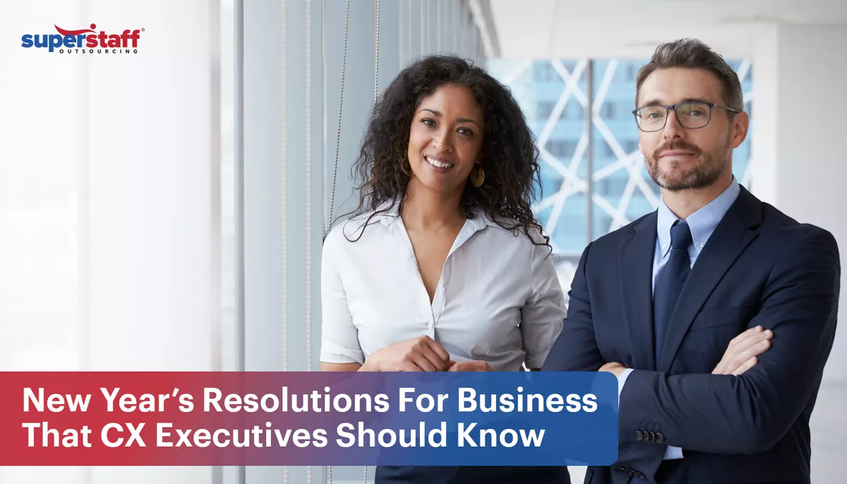 Two executives smile while standing next to each other. Image captions says: New Year’s Resolutions For Business That CX Executives Should Know.