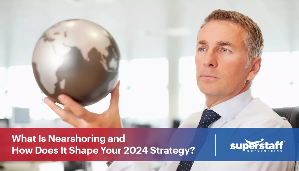 What-Is-Nearshoring-and-How-Does-It-Shape-Your-2024-Strategy An executive looks at a globe. The image caption says: What is nearshoring and how does it shape your 2024 strategy?