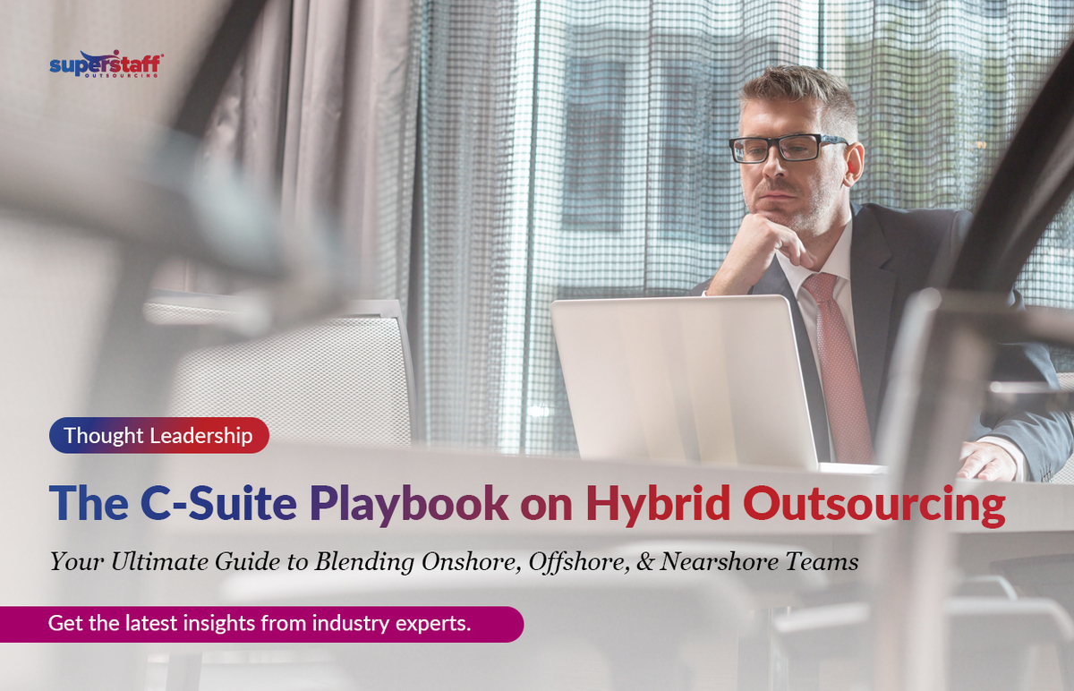 The-C-Suite-Playbook-on-Hybrid-Outsourcing_Featured An executive is working. Image caption reads: The C-Suite Playbook on Hybrid Outsourcing.