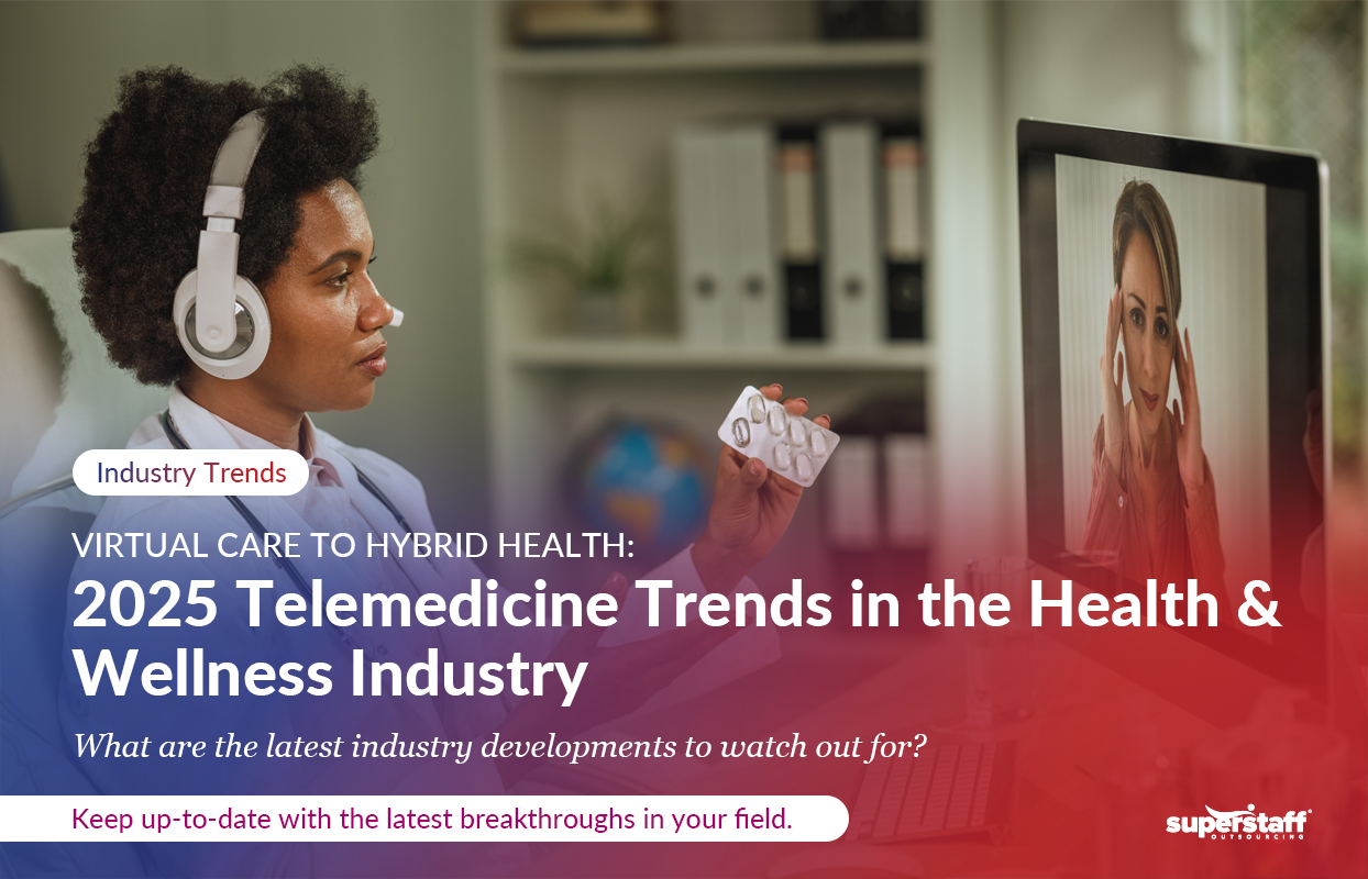 Virtual-Care-to-Hybrid-Health_Featured A healthcare professional wearing a headset holds a blister pack of pills while engaging in a telemedicine consultation with a patient displayed on a computer screen. Text overlay highlights '2025 Telemedicine Trends in the Health & Wellness Industry' with a focus on virtual care and hybrid health.