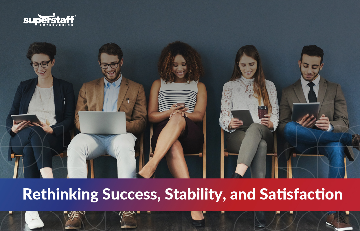 The-Biggest-Job-Market-Trends-in-2025_Featured Diverse group of young professionals seated in a row using digital devices, symbolizing remote work, digital fluency, and evolving job market trends of 2025.