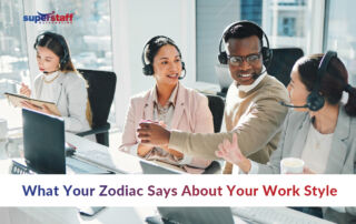 Four call center employees wearing headsets are working together in a bright, modern office. They are smiling and engaging with each other, suggesting a positive and collaborative atmosphere. The text says, "What Your Zodiac Says About Your Work Style," and the SuperStaff logo appears in the top left corner.
