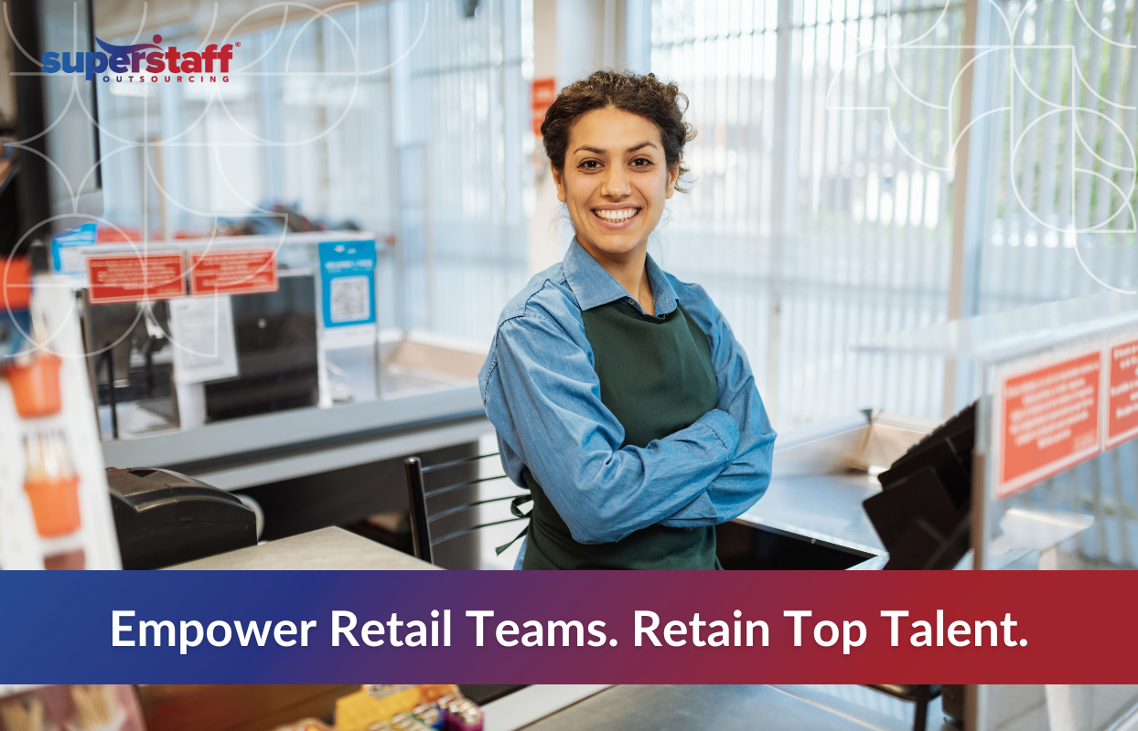 Enhancing_Retail_Featured Smiling retail worker standing confidently behind a checkout counter, symbolizing the importance of empowering teams and boosting retail workforce retention in a competitive job market.