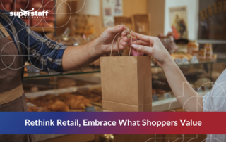 Close-up of a store employee handing a paper bag to a customer in a bakery setting, illustrating personal service and shifting retail industry trends 2025 focused on consumer value.