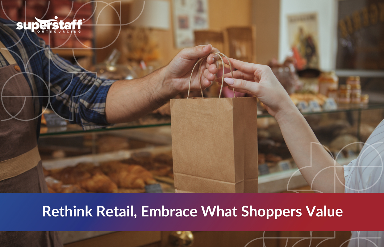 Pragmatic_Consumers_Featured Close-up of a store employee handing a paper bag to a customer in a bakery setting, illustrating personal service and shifting retail industry trends 2025 focused on consumer value.