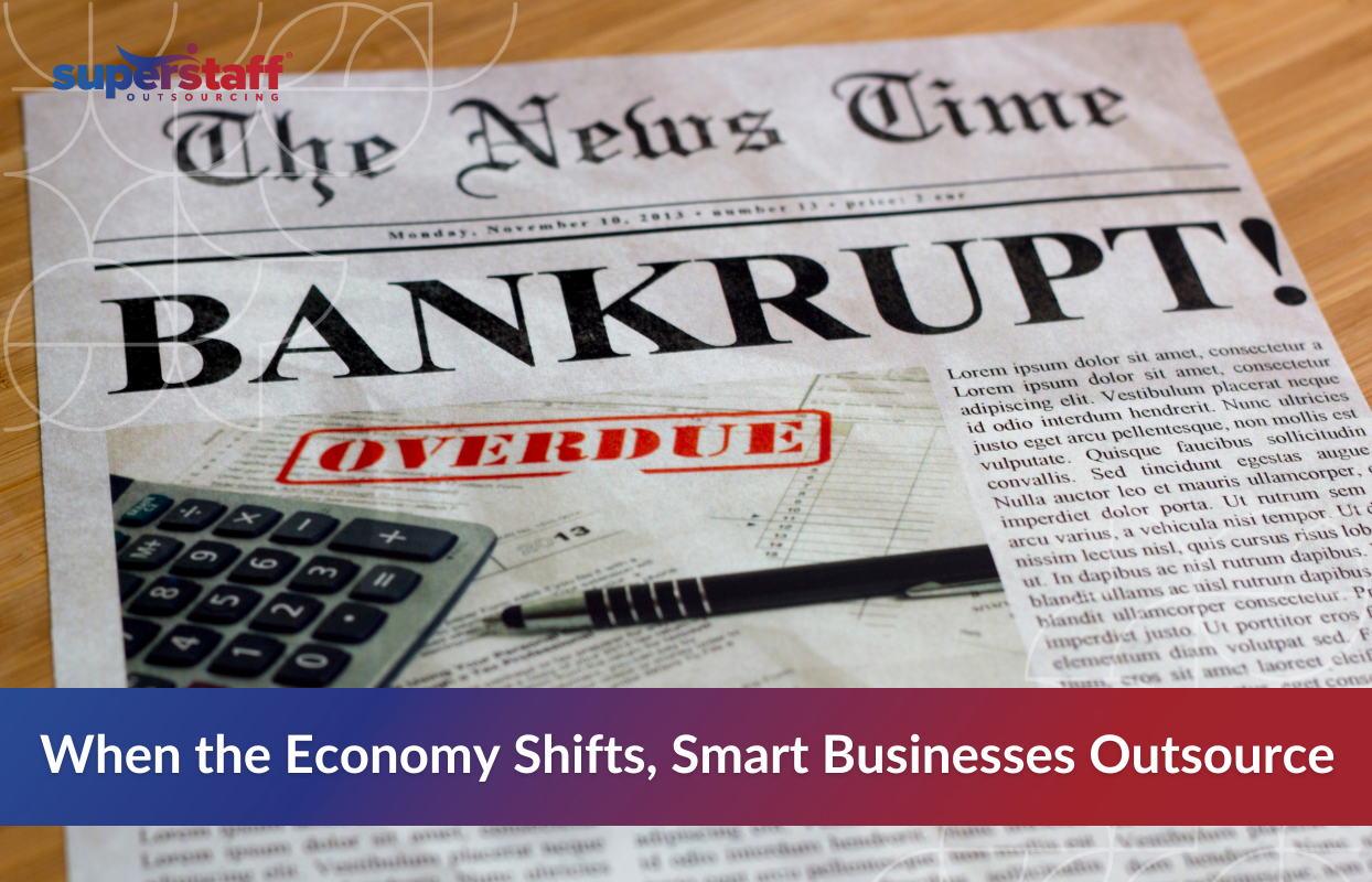 A newspaper headline reading "Bankrupt" and "Overdue" with a calculator and pen in the frame, symbolizing financial distress. Overlaid text reads: “When the Economy Shifts, Smart Businesses Outsource.” This visual emphasizes the importance of future-proofing business operations through outsourcing during economic downturns.