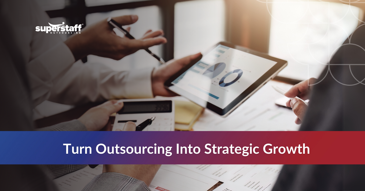 Team collaborating with a tablet and documents, focusing on outsourcing for strategic growth.