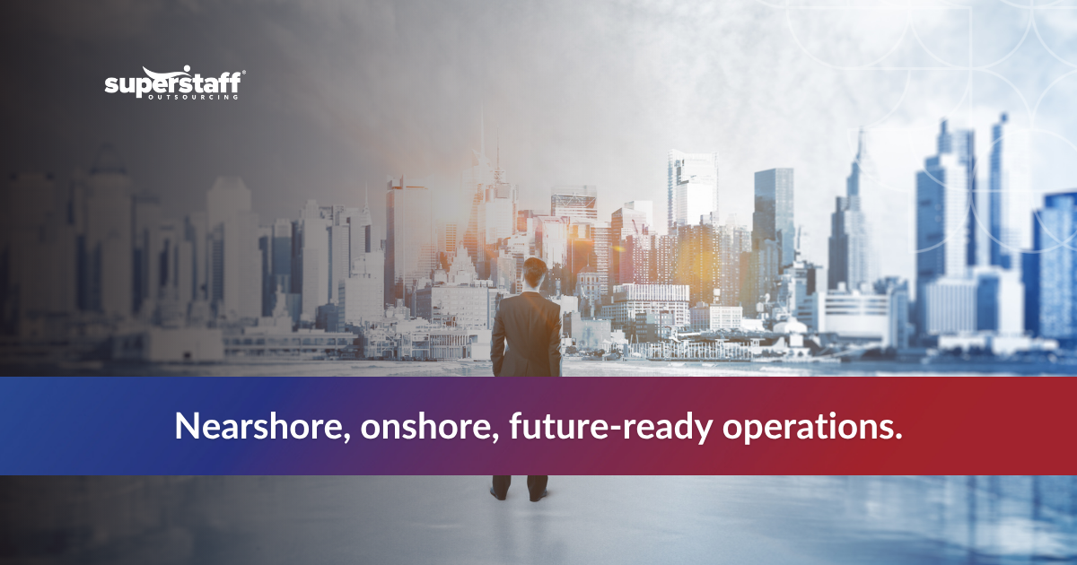 Business professional overlooks a modern city skyline, symbolizing nearshoring and onshoring trends in manufacturing.