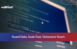 Developer coding on screen representing IT security outsourcing services