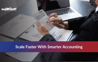 Startup professional using calculator to manage finances with an outsourced accounting firm for startups.