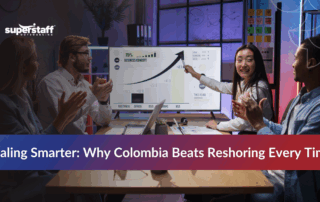 Tech startup team comparing nearshoring vs reshoring strategies to address talent shortages.