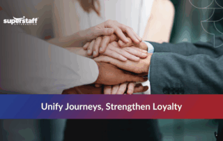 Team hands stacked together, symbolizing unity and outsourcing in customer communications management.