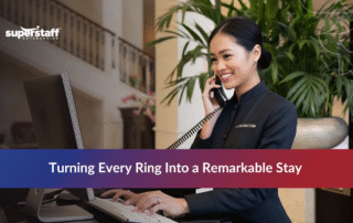 Hotel receptionist answering a call representing reliable hotel answering service for five-star guest experience.
